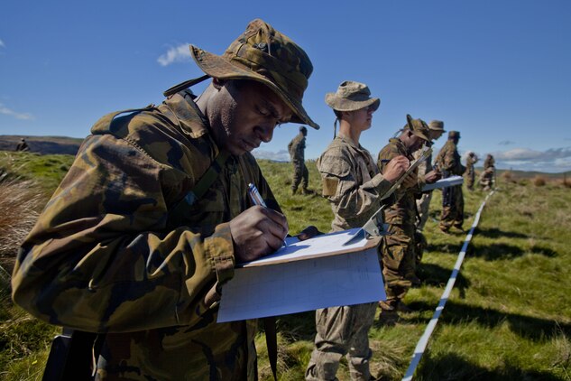 Papua New Guinean engineers from Engineer Battalion and sappers with 2 Field Squadron Royal Engineers based out of Linton Military Camp, New Zealand, identify improvised explosive devices at combat hunter training during the initial stages of exercise Southern Katipo 2013 aboard Waiouru Military Camp, New Zealand, Nov. 9. SK13 is designed to improve participating forces’ combat training, readiness and interoperability as part of a Joint Inter-Agency Task Force.