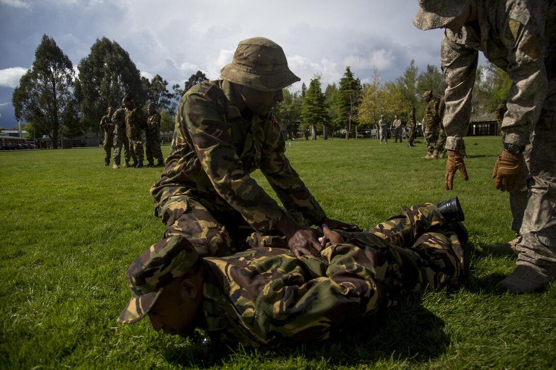 Papua New Guinean Army Pvt. Victor Tipora, a rifleman with 2nd Royal Pacific Island Regiment, performs detainee restraining procedures during the initial phase of exercise Southern Katipo 2013 (SK13) on Waiouru Military Camp, New Zealand, Nov. 7. SK13 is a New Zealand led training exercise to enhance interoperability between coalition forces and to help the New Zealand Defence Force further develop its amphibious capabilities.