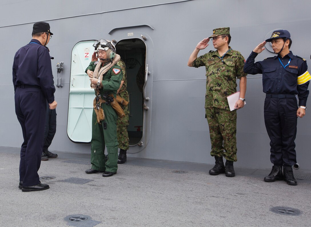 Gen. Shigeru Iwasaki prepares to board an MV-22B Osprey and return to Marine Corps Air Station Futenma in Okinawa Nov. 12 aboard the Japan Maritime Self-Defense Force ship Ise while at sea. This marked the first time an Osprey landed on a JMSDF ship in the Asia-Pacific region. Iwasaki is the chief of joint staff for the Japan Self-Defense Forces. The Osprey is with Marine Medium Tiltrotor Squadron 265, 1st Marine Aircraft Wing, III Marine Expeditionary Force, currently assigned to the 31st Marine Expeditionary Unit. (U.S. Marine Corps photo by Lance Cpl. Matthew S. Myers/Released)