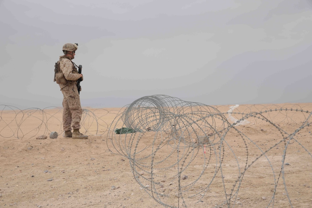 CAMP BUEHRING, KUWAIT (Nov. 1, 2013)A U.S. Marine with 13th Marine Expeditionary Unit stands watch at a post aboard Camp Buehring, Kuwait Nov. 1, 2013. The 13th MEU is deployed with the Boxer Amphibious Ready Group as a theater reserve and crisis response force throughout the U.S. 5th Fleet area of responsibility. (U.S. Marine Corps photo by Cpl. David Gonzalez, 13th Marine Expeditionary Unit Combat Camera/Released)