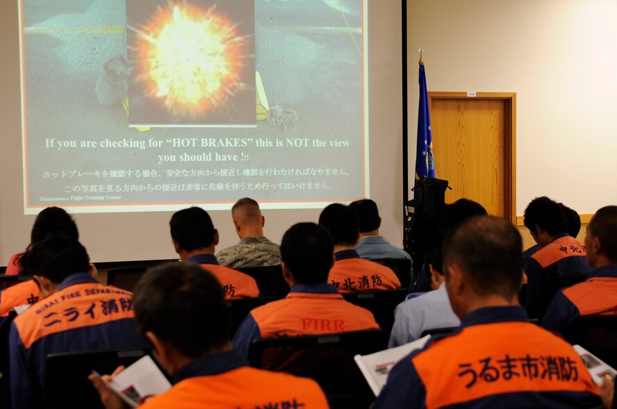 More than 35 local emergency first responders received emergency aircraft safety training from the 18th Civil Engineer Squadron firefighters at Kadena Air Base, Japan, Nov. 6, 2013. The training is held biannually as part of a 2008 agreement between the Japanese government and the U.S. military to protect Japanese and American lives. (U.S. Air Force photo by Senior Airman Marcus Morris)
