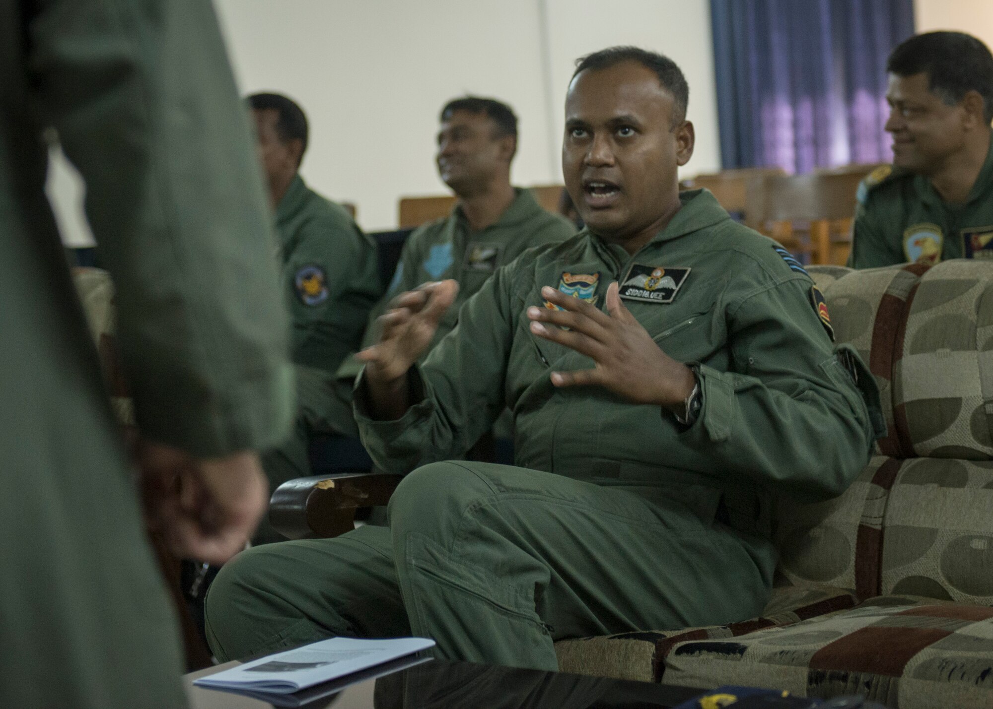 Bangladeshi Air Force Wing Commander Rashed Siddiquee, Flight Commander of Operations, 3rd Squadron, AN-32, discusses Low-Cost, Low Altitude airdrop techniques with U.S. Airmen during exercise Cope South at Bangabandhu Air Base, Bangladesh, Nov. 11, 2013. The exercise is designed to cultivate common bonds, foster goodwill, and improve readiness and compatibility between members of the Bangladesh and U.S. Air Force. (U.S. Air Force photo by Captain Raymond Geoffroy/Released)
