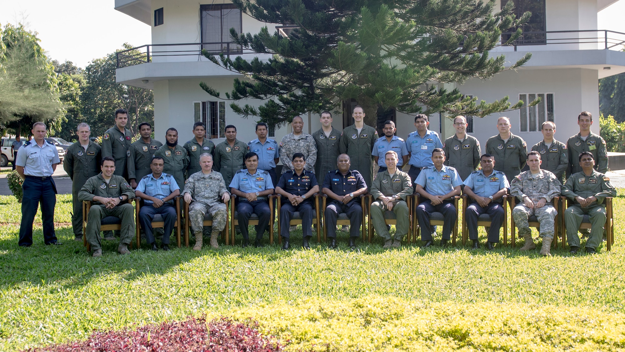 Bangladeshi and U.S. Airmen pose for a group photo after the exercise Cope South 14 opening ceremony at Bangabandhu Air Base, Bangladesh, Nov. 9, 2013. The exercise is designed to cultivate common bonds, foster goodwill, and improve readiness and compatibility between members of the Bangladesh and U.S. Air Force. (U.S. Air Force photo by Captain Raymond Geoffroy/Released)
