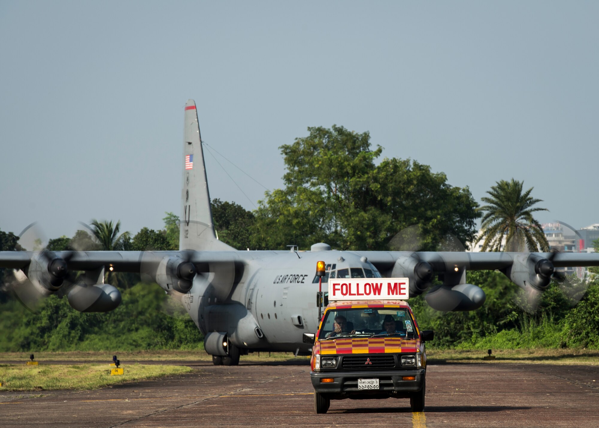 A U.S. Air Force C-130 Hercules from Yokota Air Base, Japan, arrives at Bangabandhu Air Base, Bangladesh, prior to exercise Cope South, Nov. 7, 2013. Approximately 80 U.S. Airmen and 3 C-130s are teaming up with Bangladeshi Airmen to exchange airlift expertise through a series of missions and subject-matter expert exchanges. (U.S. Air Force photo by Captain Raymond Geoffroy/Released)