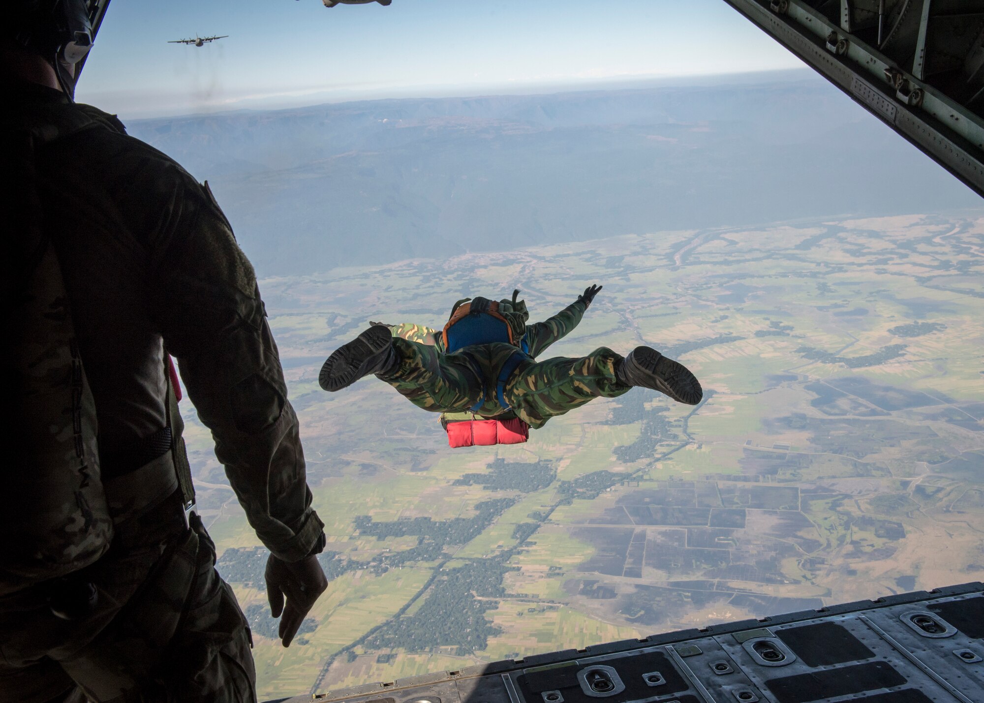 A Bangladeshi Commando leaps from a U.S. C-130 Hercules during exercise Cope South over Bangladesh, Nov. 10, 2013. Cope South is designed to provide Bangladeshi and U.S. forces the opportunity to strengthen relations and promote interoperability. (U.S. Air Force photo by Captain Raymond Geoffroy/Released)