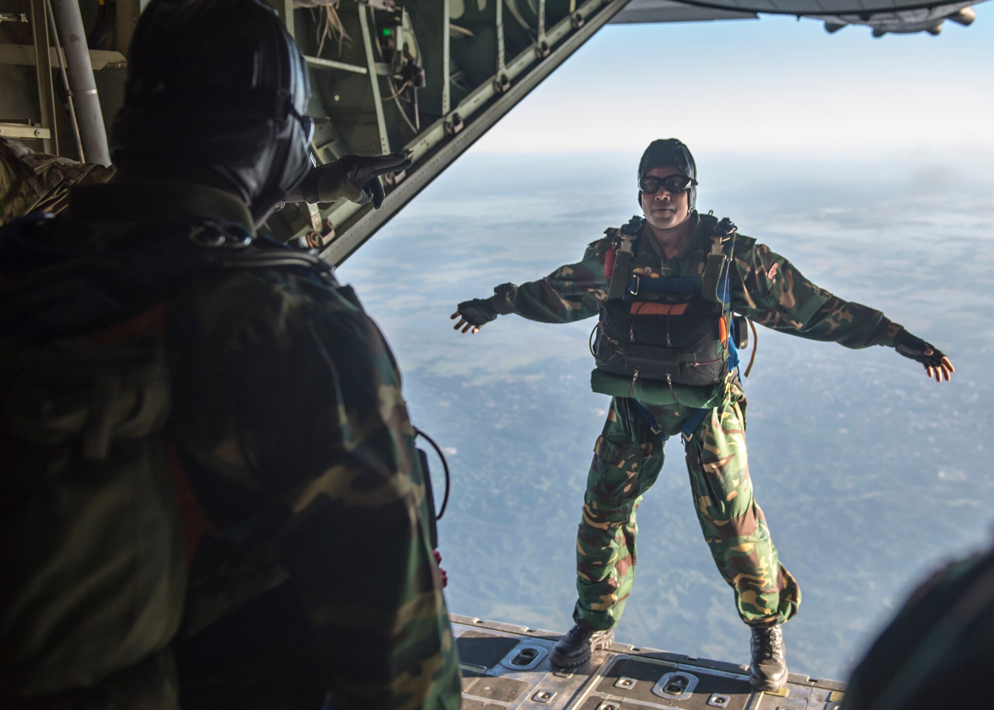 A Bangladeshi Commando leaps from a U.S. C-130 Hercules during exercise Cope South over Bangladesh, Nov. 9, 2013. Cope South is designed to provide Bangladeshi and U.S. forces the opportunity to strengthen relations and promote interoperability. (U.S. Air Force photo by Captain Raymond Geoffroy/Released)