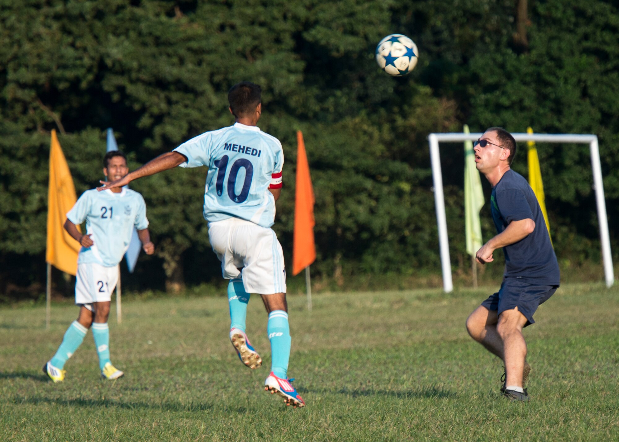 Captain Mark Nexton, a pilot from the 36th Airlift Squadron, faces off with a professional official Bangladesh Air Force team member during a match at Bangabandhu Air Base, Bangladesh, Nov. 8, 2013. Nexton joins approximately 80 U.S. Airmen participating in exercise Cope South in Bangladesh. (U.S. Air Force photo by Captain Raymond Geoffroy/Released)