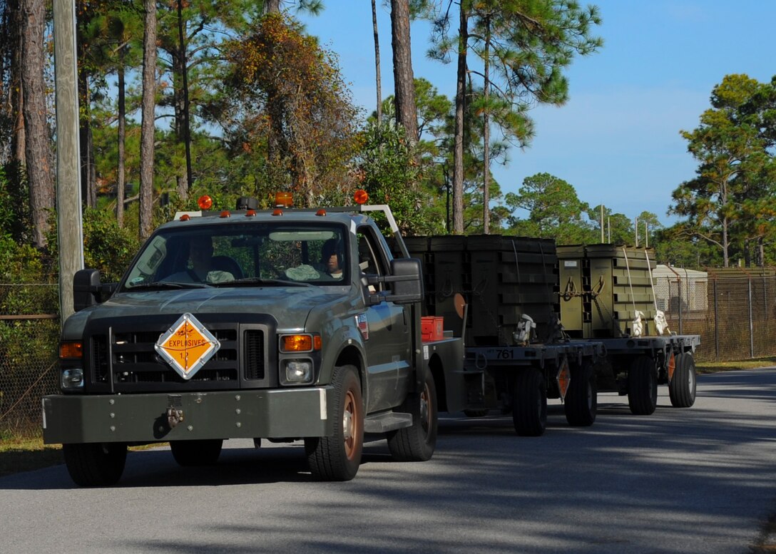 Line drivers from the 1st Special Operations Equipment Maintenance Squadron, haul munitions trailers at Hurlburt Field, Fla., Nov. 6, 2013. Drivers hauled trailers and equipment to and from the flightline. (U.S. Air Force photo/Staff Sgt. John Bainter)