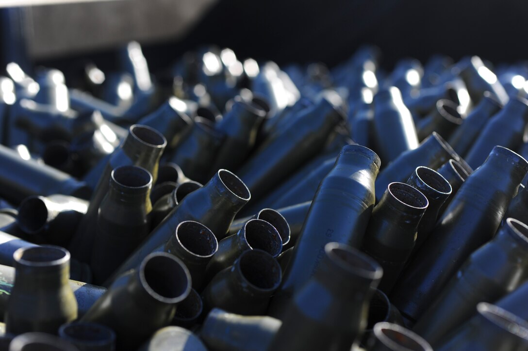 Spent 25mm shell casing sit in a bin at Hurlburt Field, Fla. Nov. 6, 2013. Shell casings brought to the facility are recycled into new ammunition. (U.S. Air Force photo/Staff Sgt. John Bainter)