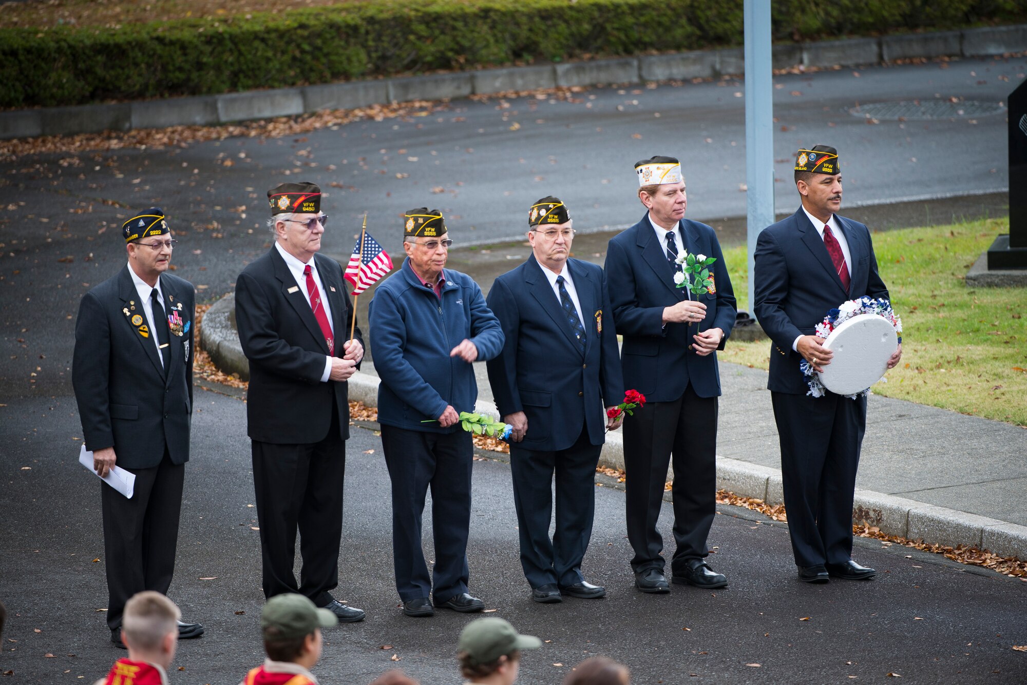 Members of the Yokota Veterans of Foreign Wars Post 9555 pay tribute to veterans during a ceremony on Veterans Day at Yokota Air Base, Japan, Nov. 11, 2013. Veterans Day pays tribute to service members, past and present, while honoring the significance of their service. (U.S. Air Force photo by Staff Sgt. Chad C. Strohmeyer/Released)