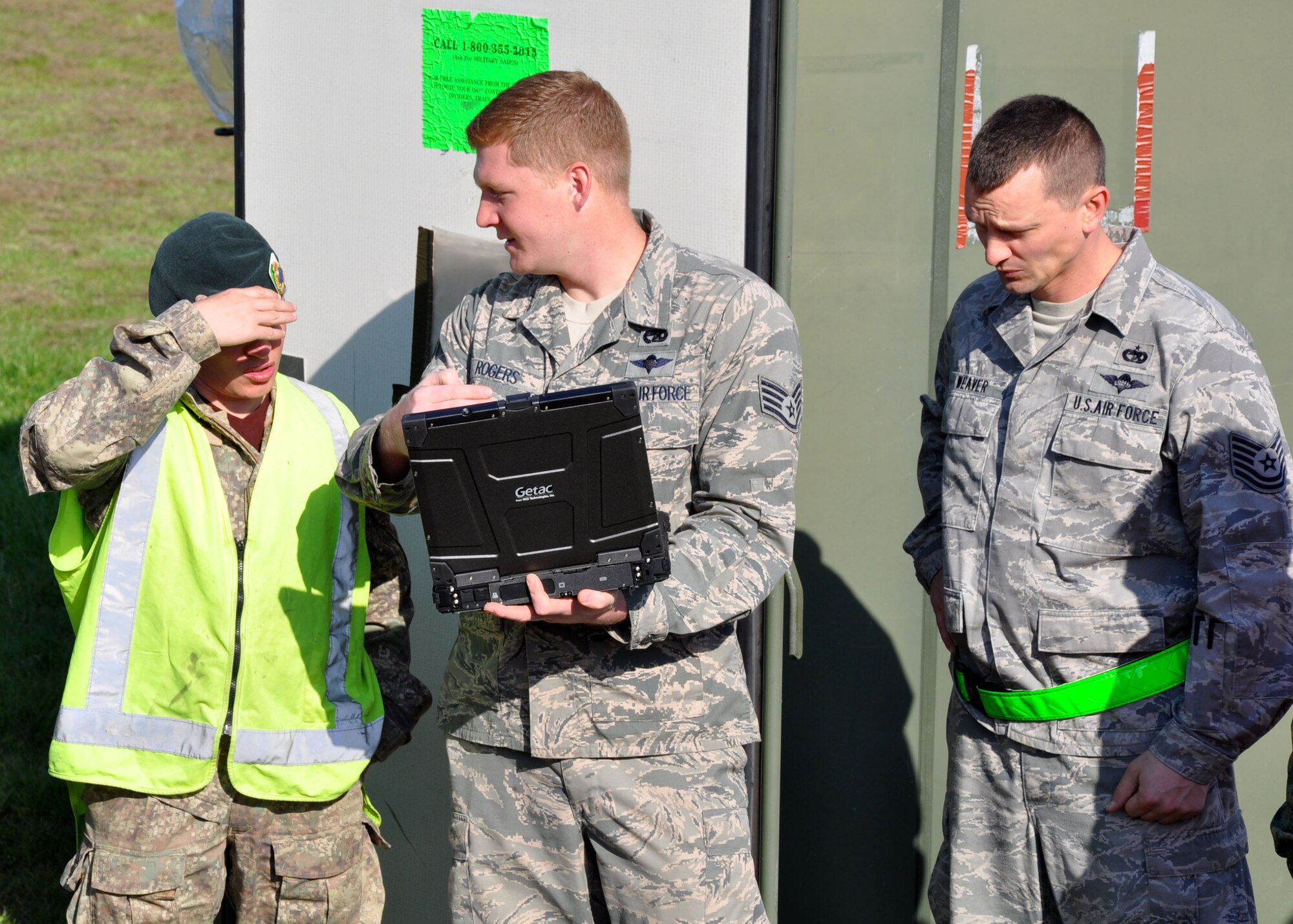 Military parachute riggers from three nations joined together for a subject-matter exchange at Royal New Zealand Air Force Base Ohakea, New Zealand, Nov. 11 during the second annual Exercise Kiwi Flag. U.S. Air Force trainers deployed to the 517th Expeditionary Airlift Squadron taught attendees how to rig a 15-foot extraction chute to the 160-foot extraction line for cargo air-drops from the C-17. The small drogue chute, attached to a 60-foot line, sits in the back of the aircraft where it is pre-staged to catch the air current from the open ramp when activated mid-flight. When the drogue chute catches the current, the drogue rapidly pulls the extraction package, which in turn, pulls the cargo through the opening in the rear of the plane. The combat mobility team, deployed from the 773rd Logistics Readiness Squadron at Joint Base Elmendorf-Richardson, Alaska, trained more than 20 personnel from the New Zealand Army, the RNZAF and the Republic of Singapore Air Force. The Pacific-partners will have numerous opportunities to practice the newly-attained skill during the exercise which runs through Nov. 29. Kiwi Flag personnel are supporting Exercise Southern Katipo -- held on New Zealand's South Island -- by managing air operations and providing cargo and passenger airlift including tactical air drops to SK participants. (U.S. Air Force Photo by Senior Master Sgt. Denise Johnson/Released)