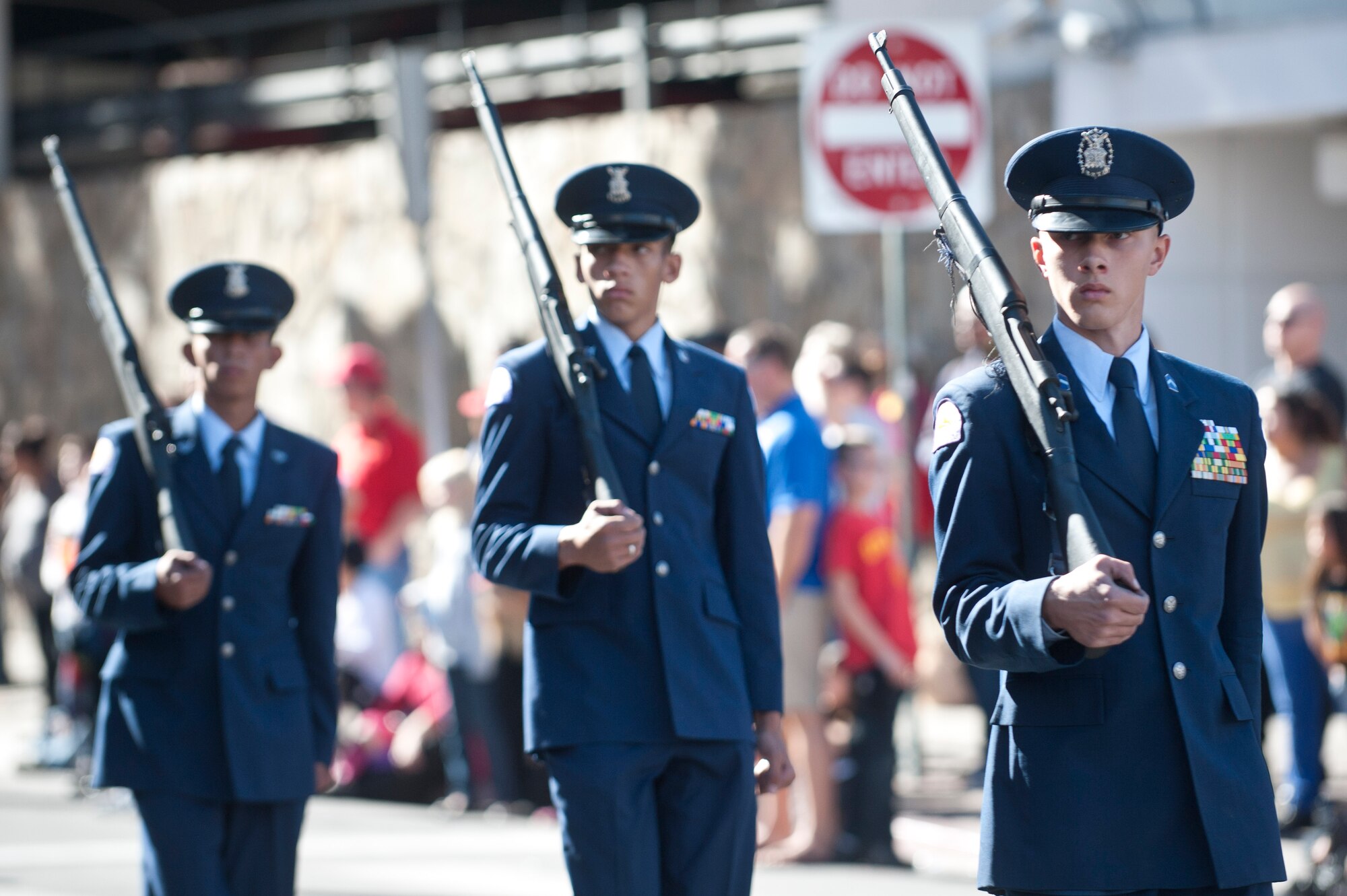 Junior ROTC cadets, march down 4th Street during the Las Vegas Veterans Day Parade Nov. 11, 2013, in Las Vegas.  Brig. Gen. Stephen Whiting, U.S. Air Force Warfare Center vice commander, provided opening remarks during the parade, Nellis Air Force Base Honor Guard members posted the colors and redeploying Airmen also participated in the event. (U.S. Air Force photo by Staff Sgt. Christopher Hubenthal)