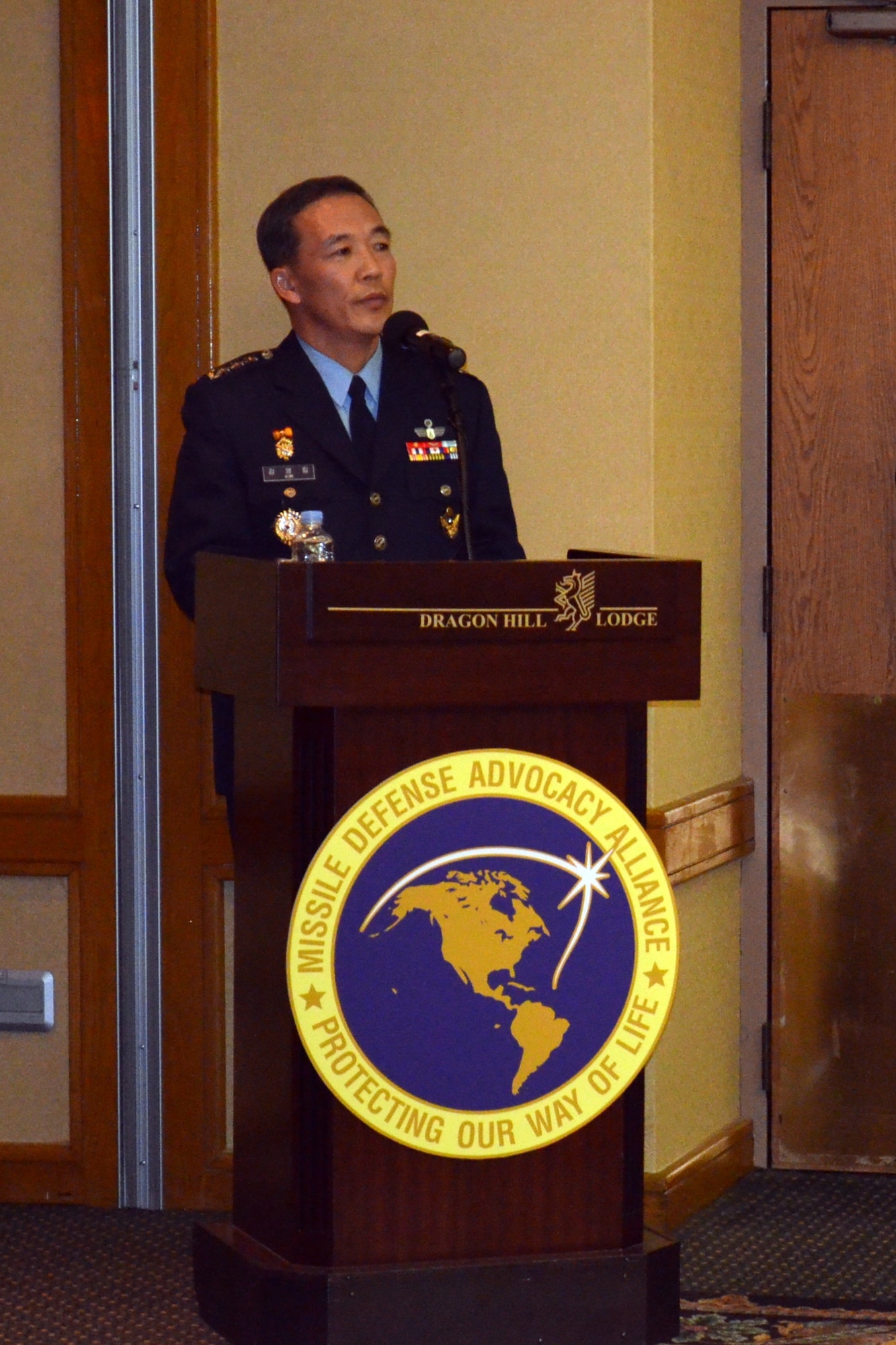 OSAN AB, Republic of Korea – Colonel Kim, Young Lim leaves the crowd laughing as claims to have visited three American locations:  Hawaii, Osan AB and Yongsan Garrison.  The latter two are U.S. military installations in the ROK. (U.S. Army photo by Spc. Shawn Denham, 35th ADA Public Affairs)

