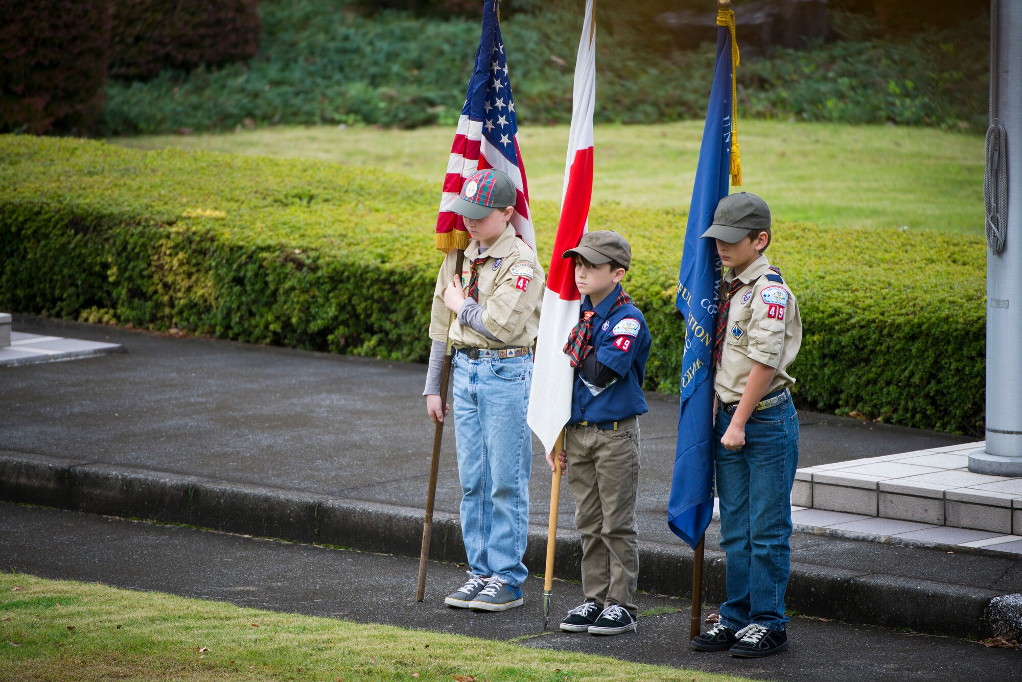 Yokota Boy Scouts pay tribute to veterans during a ceremony on Veterans Day at Yokota Air Base, Japan, Nov. 11, 2013. Veterans Day pays tribute to service members, past and present, while honoring the significance of their service. (U.S. Air Force photo by Staff Sgt. Chad C. Strohmeyer/Released)