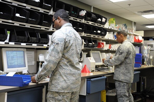 92nd Medical Group Airmen fill prescriptions for patients in the pharmacy at Fairchild Air Force Base, Wash., Nov. 12, 2013. The pharmacy serves over 30 thousand beneficiaries along with nine clinics that belong to the 92nd MDG. (U.S. Air Force photo by Airman 1st Class Janelle Patiño/Released)