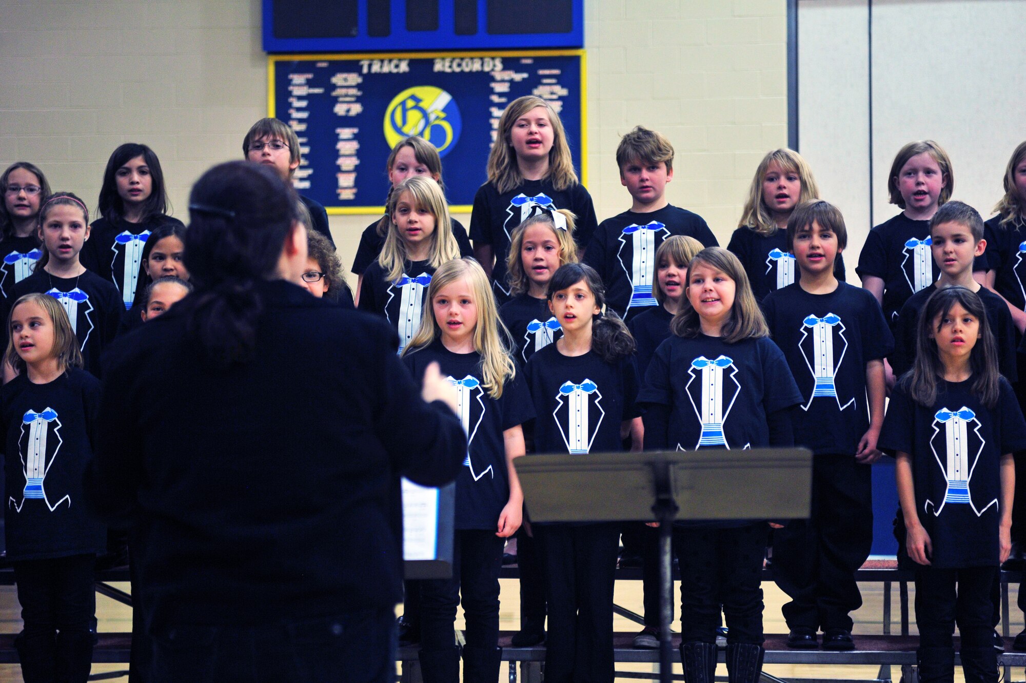Children from Michael Anderson Elementary School choir perform during a Veterans Day assembly at Fairchild Air Force Base, Wash., Nov. 7, 2013. (U.S. Air Force photo by Senior Airman Taylor Curry/Released)