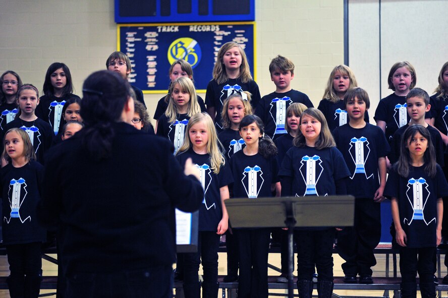 Children from Michael Anderson Elementary School choir perform during a Veterans Day assembly at Fairchild Air Force Base, Wash., Nov. 7, 2013. (U.S. Air Force photo by Senior Airman Taylor Curry/Released)