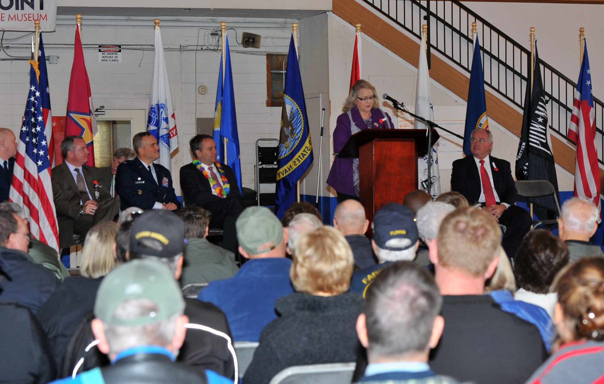 Suzanne Williams, a combat medic during the Vietnam War, performs her speech during the Veterans Day ceremony Nov. 11, 2013, at Felts Field in Spokane, Wash. Williams was the keynote speaker for the event and spoke about her tragic time in Vietnam and recovery afterward. (U.S. Air Force photo by Staff Sgt. Veronica Montes/Released)