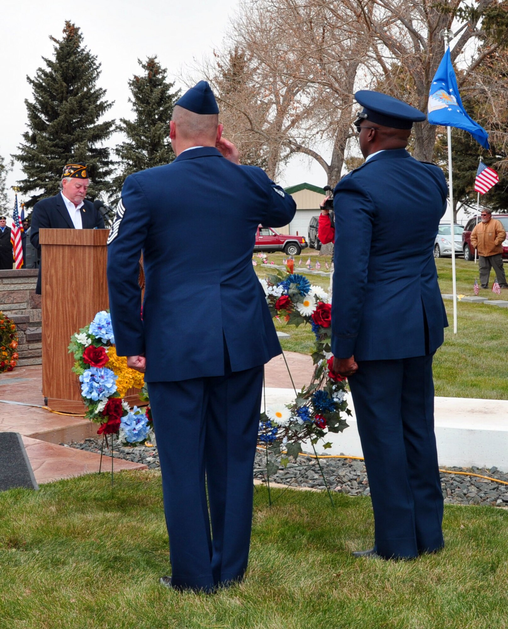 131111-F-CP692-023 Col. Carl Jones, 90th Missile Wing vice commander, and Chief Master Sgt. Mike Garrou, 90th MW command chief, render a salute after laying a wreath at a Veterans Day Ceremony at Beth El Cemetery, Cheyenne, Wyo., Nov. 11. More than 200 people attended the ceremony to pay tribute and remember the nation’s veterans. (U.S. Air Force photo by 1st Lt. Eydie Sakura)