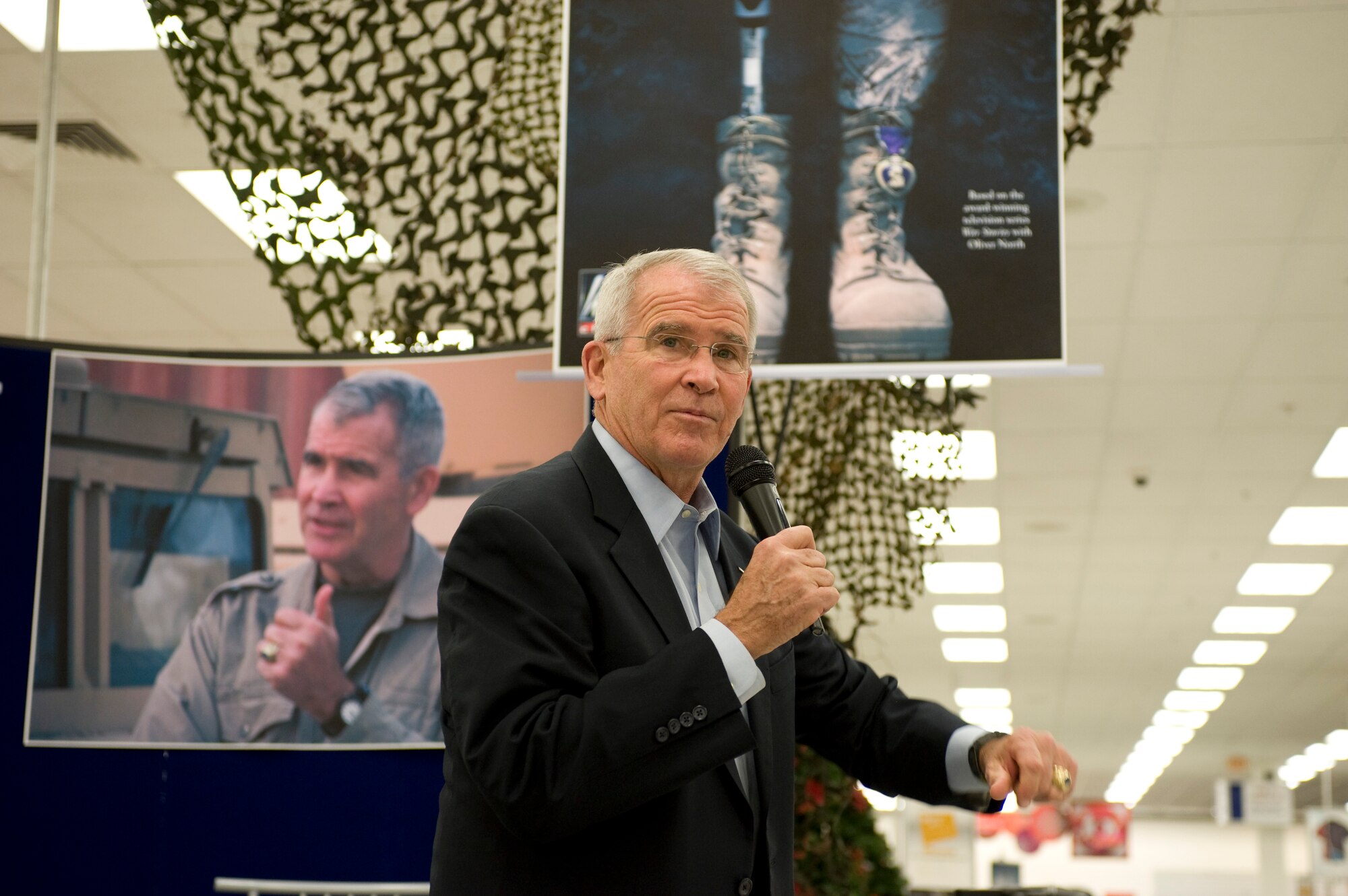 Oliver North, speaks to fans at the Exchange during a book signing Nov. 9, 2013, at Nellis Air Force Base, Nev. North signed autographs for his book “American Heroes, On the Homefront” during his visit to Nellis AFB. North is currently the host of “War Stories with Oliver North” on the Fox News Channel. (U.S. Air Force photo by Airman 1st Class Christopher Tam)