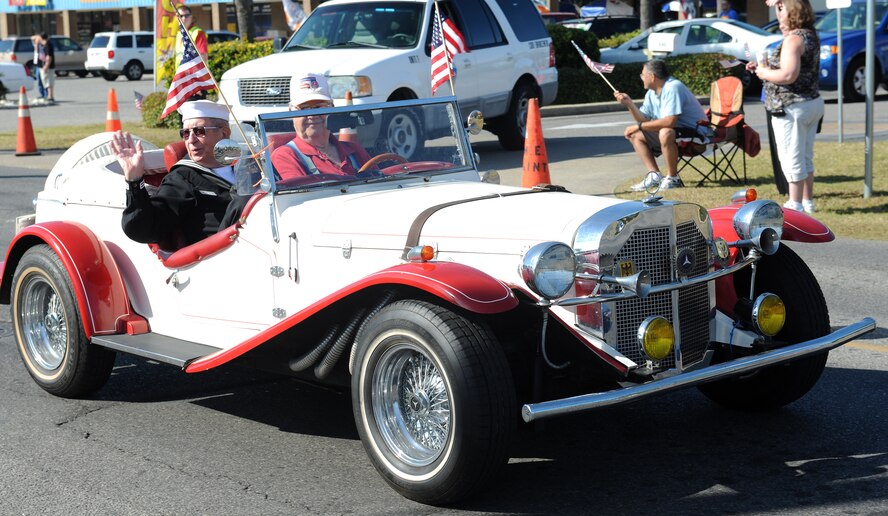 Members of the Veteran’s Day parade showcased a vintage car during the parade in Mary Esther, Fla., Nov. 11, 2013.  Service members, past and present, proudly marched in the parade and showed their patriotism in unique ways. (U.S. Air Force photo/Senior Airman Kentavist Brackin)