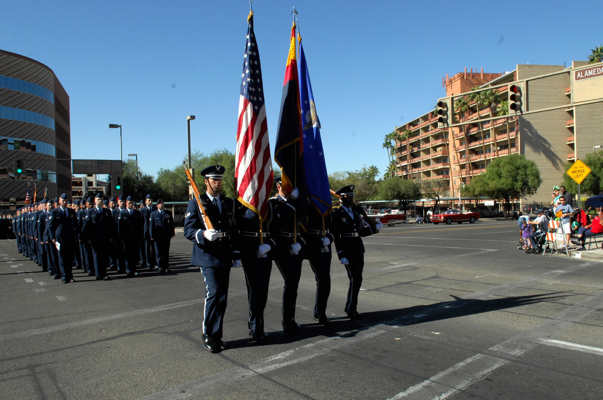 U.S. Air Force Airmen from Davis-Monthan Air Force Base, Ariz., march in the annual Veterans Day Parade in Tucson, Ariz. Nov. 11, 2013. The formation consisted of 40 volunteers that walked in cadence down the streets lined with kids, veterans and families. (U.S. Air Force photo by Airman 1st Class Betty R. Chevalier/released)(cropped)