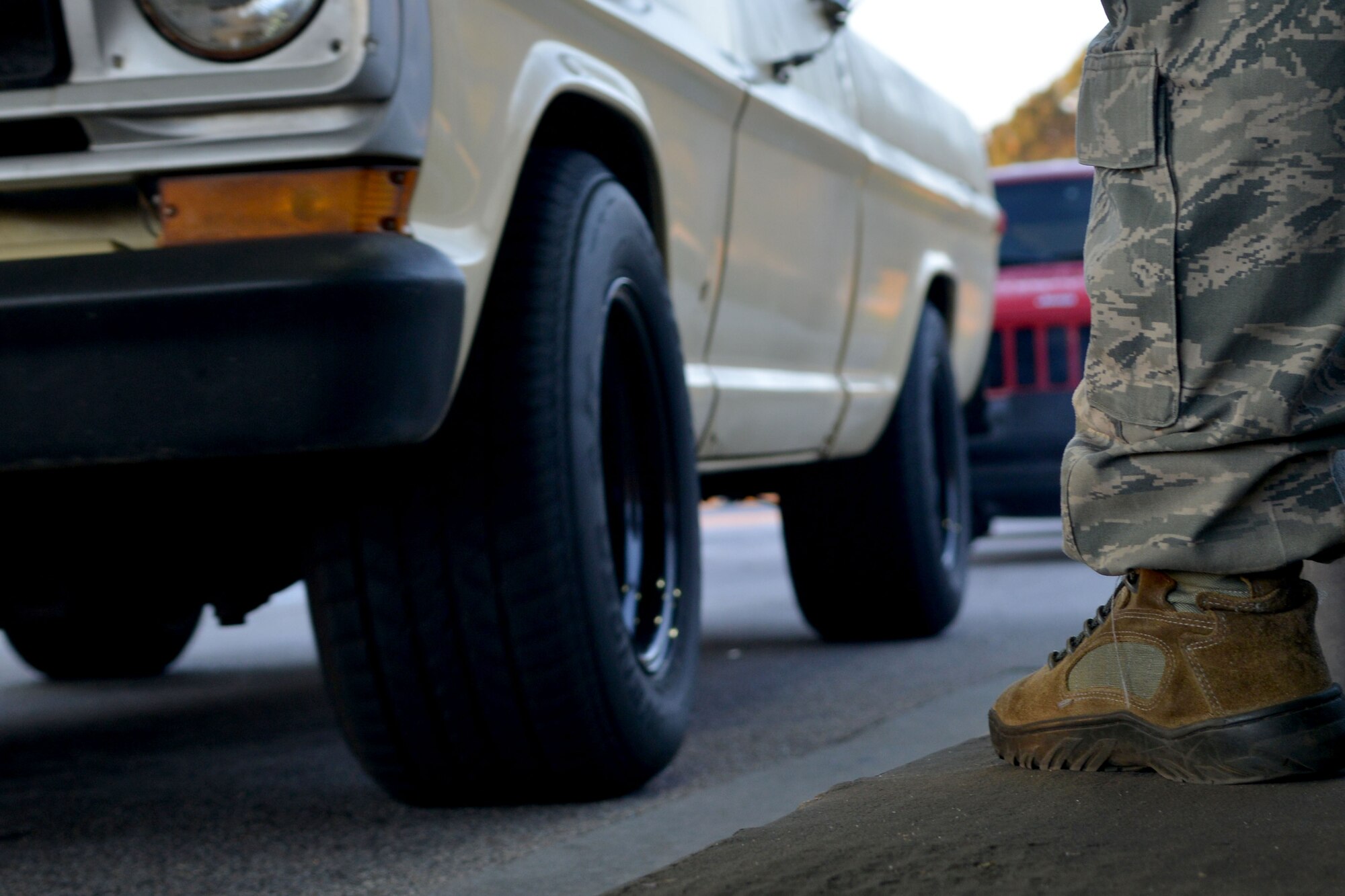 A 20th Security Force Squadron patrolman, waits for the next car to stop, Shaw Air Force Base, S.C., Nov. 12, 2013. Airmen from the 20th SFS are tasked to secure and defend Shaw and are expected to protect the base and assets 24/7. (U.S. Air Force photo by Airman 1st Class Ashley L. Gardner/Released