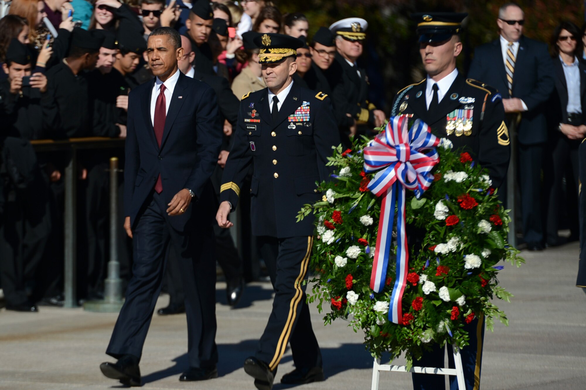 President Barack Obama, left, walks with U.S. Army Maj. Gen. Jeffrey S. Buchanan, commander of U.S. Army Military District of Washington, at the Tomb of the Unknowns during a Veterans Day ceremony at Arlington National Cemetery in Arlington, Va., Nov. 11, 2013. (DOD photo by EJ Hersom/Released)