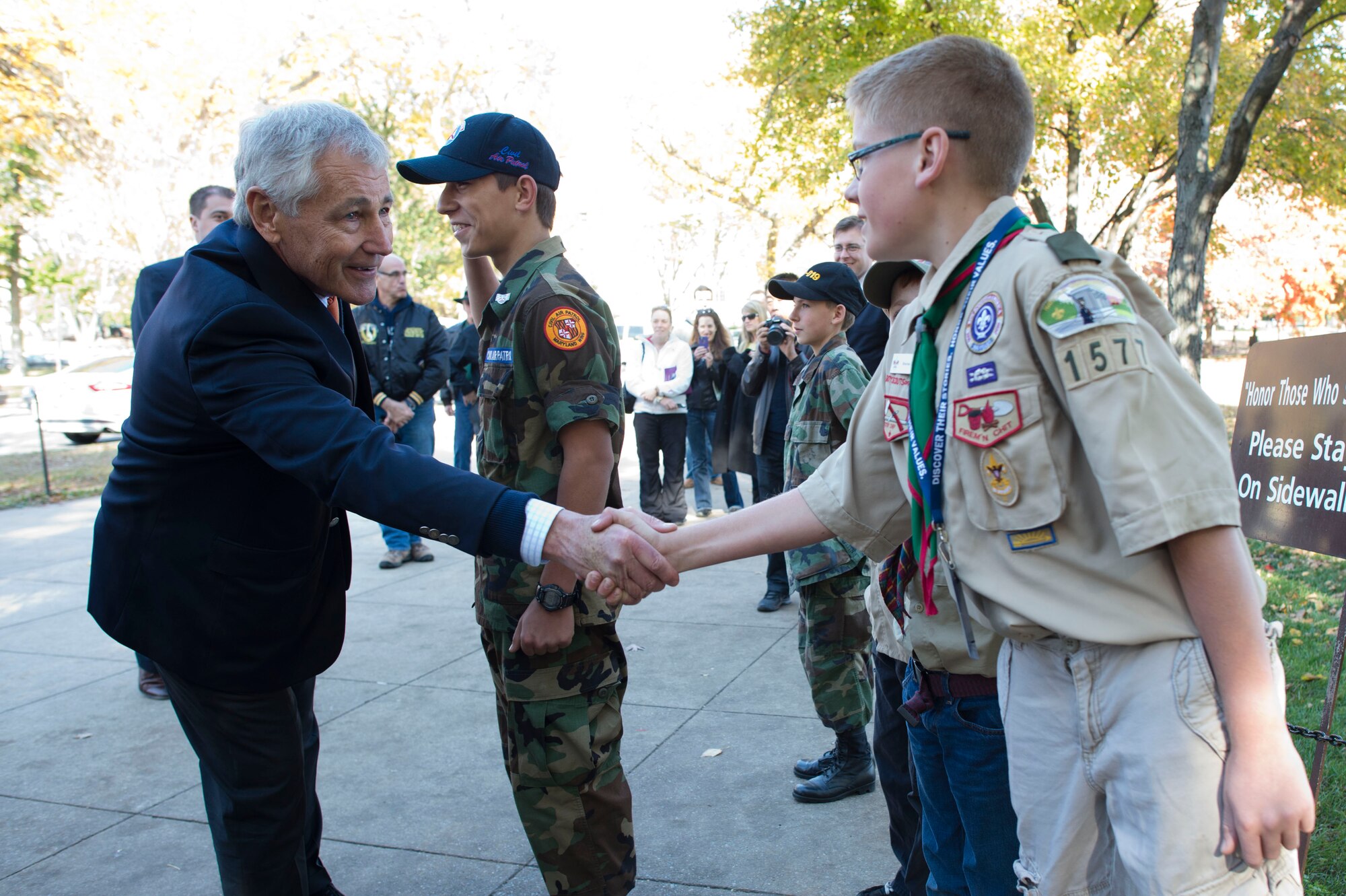 Defense Secretary Chuck Hagel greets a boy scout at the Vietnam War Memorial in Washington D.C., Nov. 11, 2013. Hagel, a Vietnam veteran, walked the wall and greeted veterans. (DOD photo by Erin A. Kirk-Cuomo/Released)
