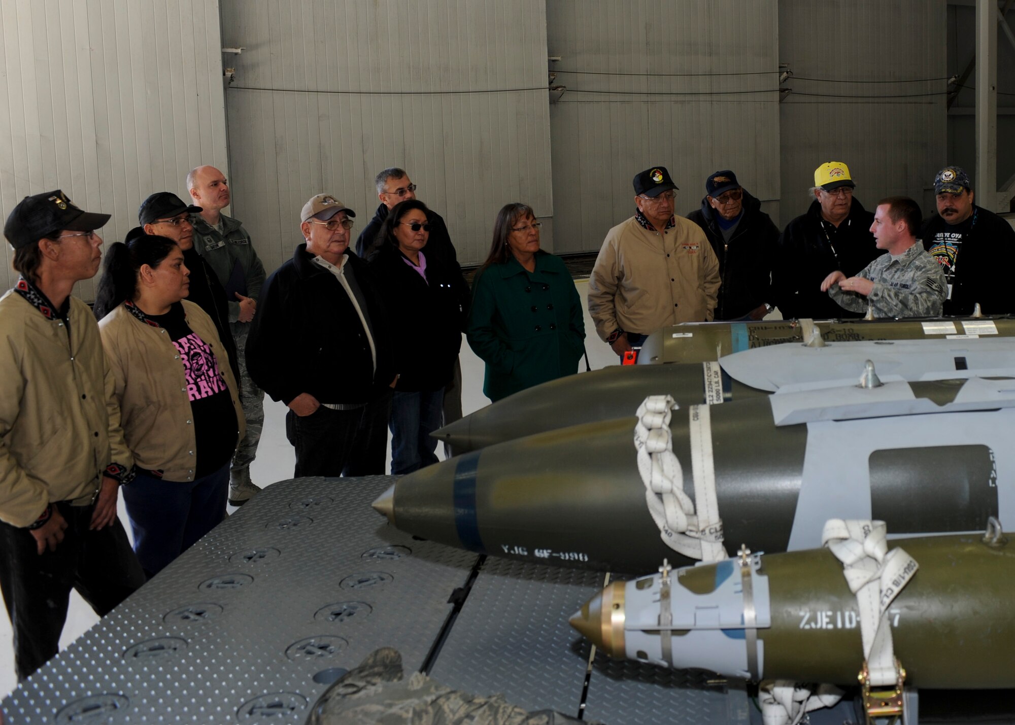 Staff Sgt. Kyle Haun, 28th Munitions Squadron conventional maintenance technician, explains the characteristics of the many munitions that B-1 aircrews can employ to a group of Native American veterans during an event at Ellsworth Air Force Base, S.D., Nov. 8, 2013. During the event, visitors toured a number of base facilities, watched demonstrations, gathered for a meal and warrior cross talk. (U.S. Air Force photo by Senior Airman Anania Tekurio/Released)