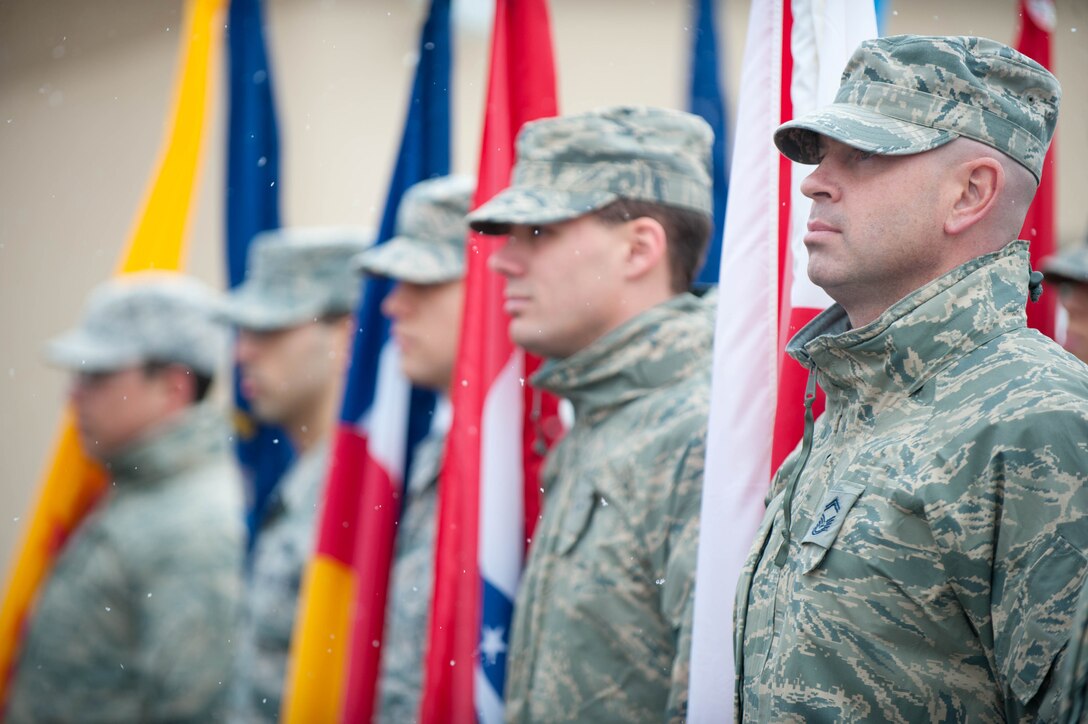 Airmen from Ellsworth Air Force Base stand post during the Veterans Day parade in Rapid City, S.D., Nov. 11, 2013. Veterans Day was originally known as Armistice Day and symbolized world peace and the end of one of humanities greatest conflicts - World War I. It wasn’t until 1954 and several years after World War II and the Korean War when congress decided the holiday would honor servicemembers who fought in all wars. (U.S. Air Force photo by Senior Airman Zachary Hada/Released)