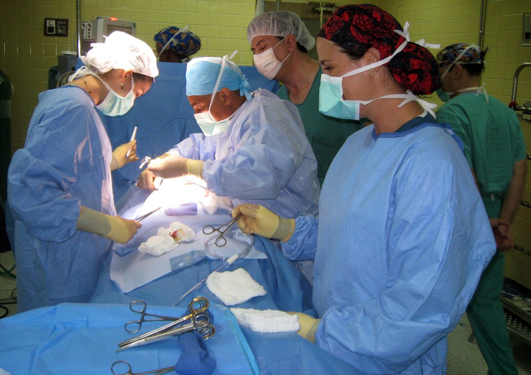 Members of Joint Task Force-Bravo's Mobile Surgical Team (MST) conduct a procedure at Hospital Escuela in Tegucigalpa, Honduras, Nov. 5, 2013.  The MST conducted operations at the hospital as part of a Medical Readiness Training Exercise and completed four surgeries and consulted on three cases.  (Courtesy photo)