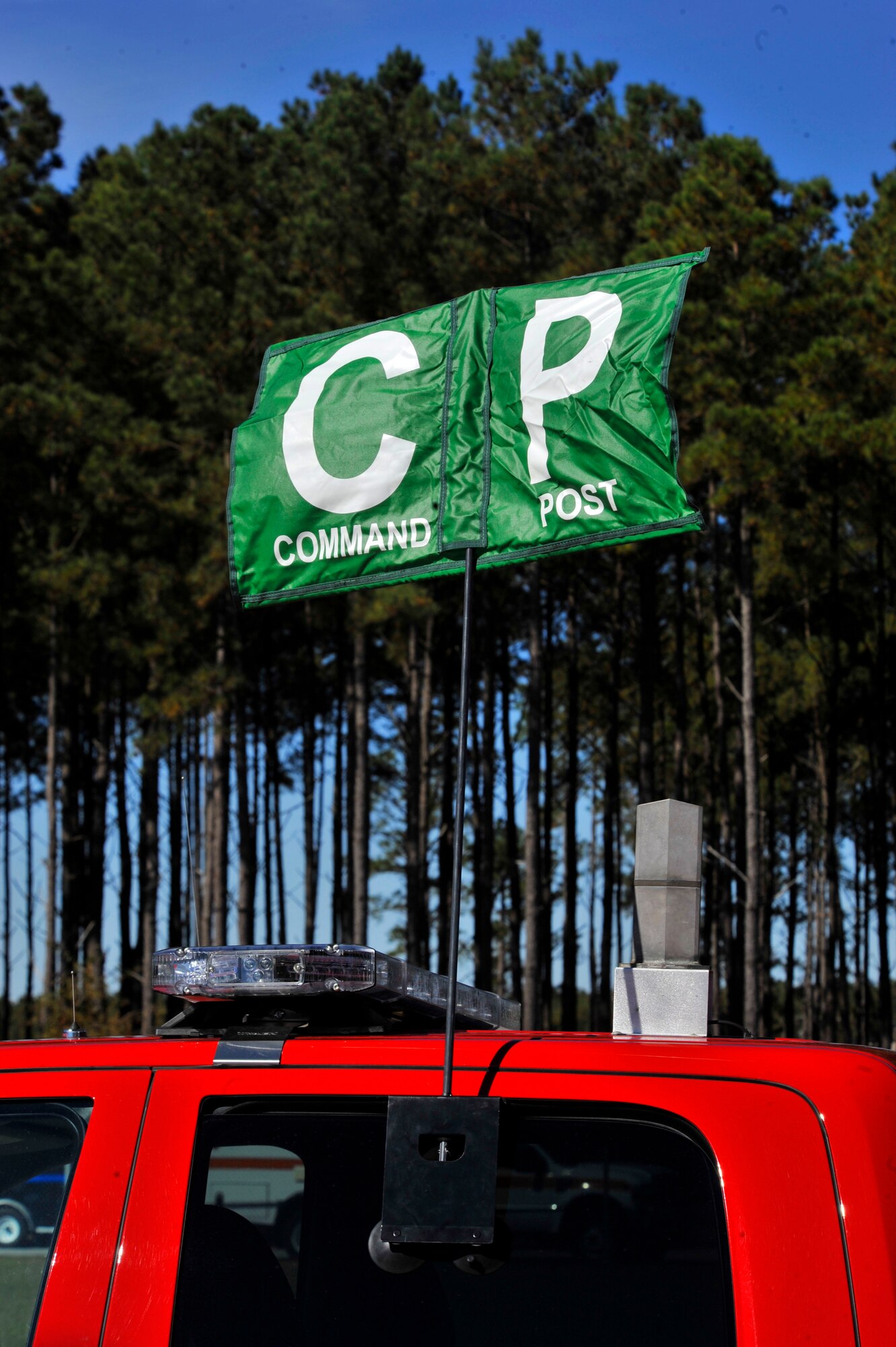 A flag designates the on-scene command post during a major accident response exercise, Shaw Air Force Base S.C., Nov. 8, 2013. During the exercise, agencies across the 20th Fighter Wing responded to a simulated suspicious vehicle at the east gate and a public health emergency of pneumonic plague within the 20th Aircraft Maintenance Squadron. (U.S. Air Force photo by Airman 1st Class Jensen Stidham)