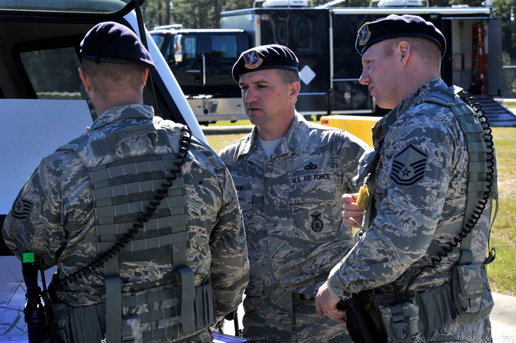 U.S. Air Force Airmen from the 20th Security Forces Squadron discuss the major accident response exercise, Shaw Air Force Base S.C., Nov. 8, 2013.
Security forces personnel were part of a multi-agency response to a simulated suspicious vehicle during the MARE. (U.S. Air Force photo by Airman 1st Class Jensen Stidham)
