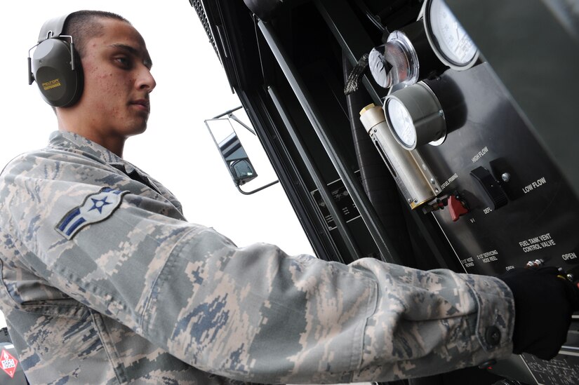 U.S. Air Force Airman 1st Class Matthew Mendez, 633rd Logistics Readiness Squadron fuels distribution operator, performs a routine check on the mobile refueling unit at Langley Air Force Base, Va., Oct. 28, 2013. Mendez showcased his attention to detail during an inspection when he noticed a discrepancy on the placement of a fire extinguisher while on the flight line, which could have caused a potential hindrance for the retardant to reach the aircraft in the event of a fuel fire. (U.S. Air Force photo by Senior Airman Brittany Paerschke-O’Brien/Released)