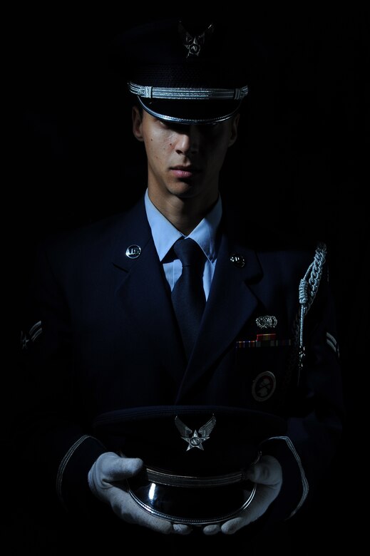 U.S. Air Force Airman 1st Class Matthew Mendez, 633rd Logistics Readiness Squadron fuels distribution operator, performed the ultimate act of wingmanship by folding the flag at a fellow Airmen’s funeral. Mendez was then selected to represent the installation in the base honor guard after exhibiting attention to detail during an inspection. (U.S. Air Force photo by Senior Airman Brittany Paerschke-O’Brien/Released)