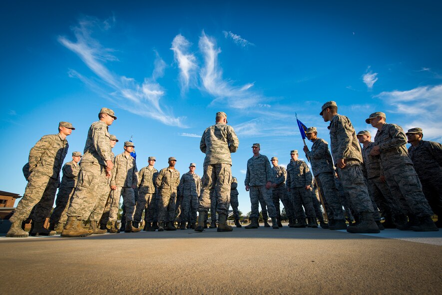 U.S. Air Force Tech. Sgt. Daniel Schumann, 23d Communications Squadron airfield systems maintenance NCO in charge, speaks to Airmen about the importance of Veterans Day at Moody Air Force Base, Ga., Nov. 8, 2013. Schumann led a flag-folding ceremony as retreat was played to honor veterans. (U.S. Air Force photo by Airman 1st Class Ryan Callaghan/Released)

