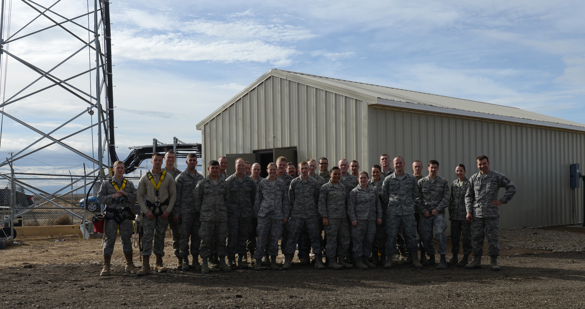 U.S. Air Force Airmen pose for a photo Nov. 09, 2013, at Mountain Home Air Force Base, Idaho. Airmen from multiple squadrons collaborated in order to build a new Ground-to-air Transmissions and Receive antenna to enable mission success. (U.S. Air Force photo by Airman 1st Class Brittany A. Chase/RELEASED)