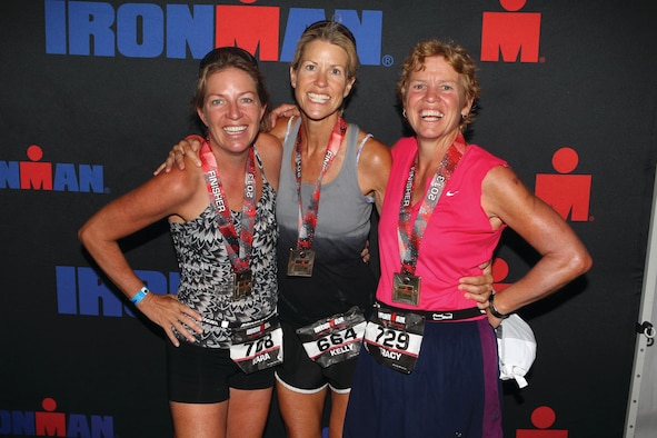 WRIGHT-PATTERSON AIR FORCE BASE, Ohio - Senior Master Sgt. Kelly Janus (Center) and her sisters Kara Smith (Left) and Tracy Burge show off their medals after completing the 2013 Louisville Ironman event Aug. 25. (Courtesy photo)
