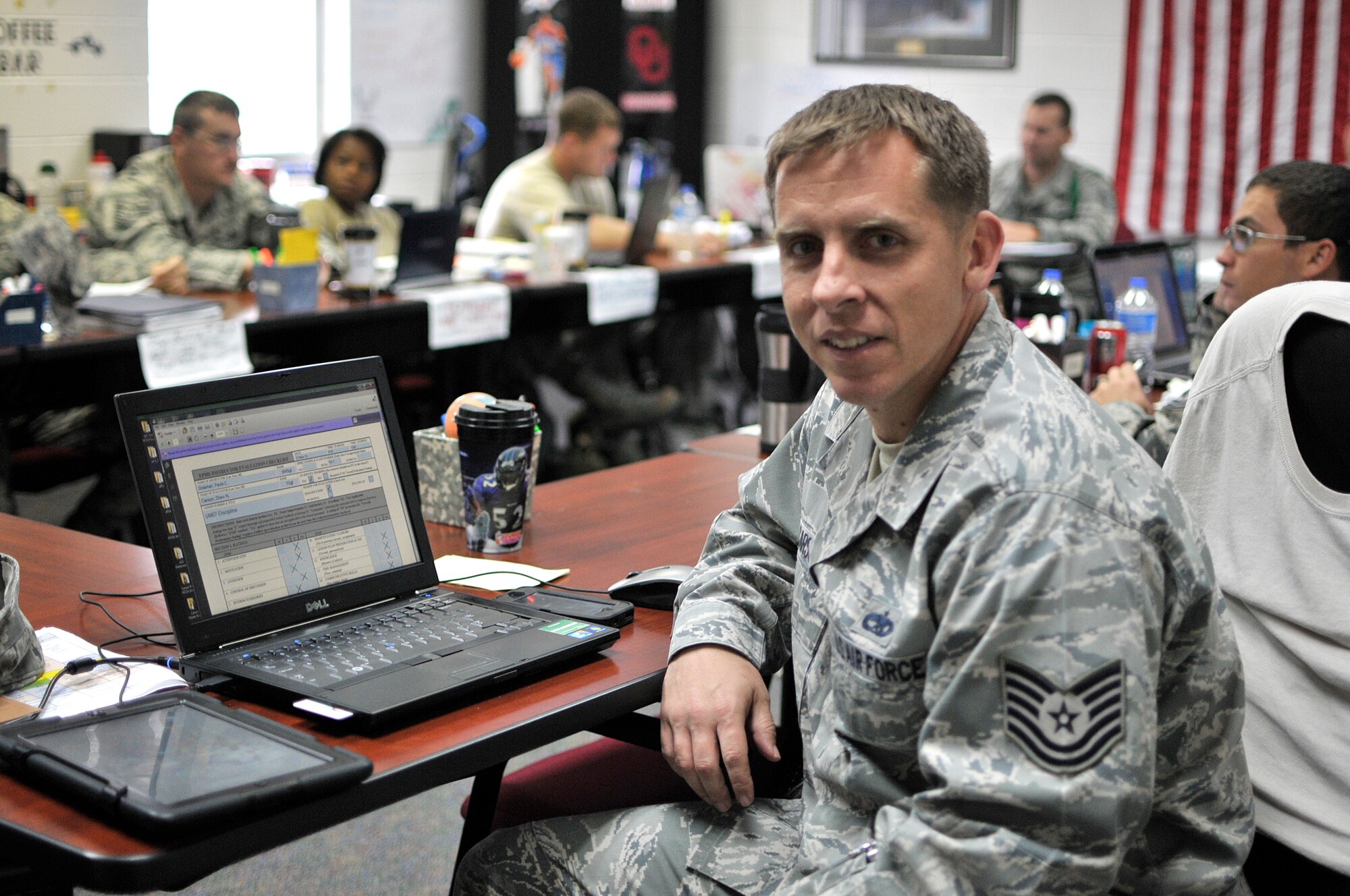 MCGHEE TYSON AIR NATIONAL GUARD BASE, Tenn. - Tech. Sgt. Drew Carson sits with C-Flight of the U. S. Air Force's Noncommissioned Officer Academy 14-1 here Nov. 12, 2013, at the I.G. Brown Training and Education Center while he observes and evaluates another instructor. Carson is an active duty enlisted professional military education instructor with the Paul H. Lankford EPME Center. He said he likes coming to work each day.  (U.S. Air National Guard photo by Master Sgt. Mike R. Smith/Released) 