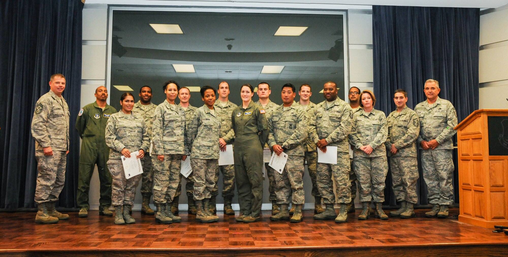 Twenty-one Airmen of the Delaware Air National Guard were recognized as graduates of the Community College of the Air Force Class of October 2013 at a ceremony held Nov. 3, 2013, at Delaware ANG Headquarters, New Castle ANG Base, Del. Pictured are 15 of the 21 graduates flanked by the two command chiefs who assisted in the presentation of certificates. From left (front row): Chief Master Sgt. Stephen Stinsky, state command chief, Delaware ANG, Staff Sgt. Shirley Hunsiker, Tech. Sgt. Zaquette Everett, Master Sgt. (now 2nd Lt.) Kemeshia Greene, Tech. Sgt. Victoria Arnold, Staff Sgt. Richard Bergante, Master Sgt. Ronald Sudler, Master Sgt. Regina Minzer, Master Sgt. Shane Hummel and Chief Master Sgt. Henry Rome, wing command chief, 166th Airlift Wing. From left (back row): Tech. Sgt. Alvin Henson, Staff Sgt. Jomarr Hatten, Staff Sgt. Wayne Borrmann, Tech. Sgt. Jon Goe, Staff Sgt. Christopher Jackowski, Senior Airman Michael Krantz and Master Sgt. Sean Henderson. (U.S. Air National Guard photo by Tech. Sgt. Robin Meredith).