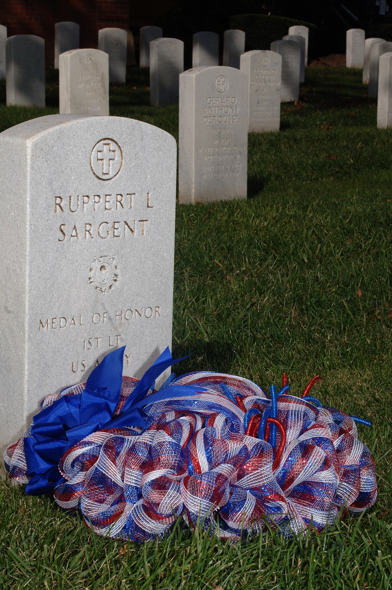 The Langley African-American Heritage Council hosted a wreath-laying ceremony in honor of U.S. Army 1st Lt. Ruppert Sargent, a Medal of Honor recipient, at the Hampton National Cemetery in Hampton, Va., Nov. 11, 2013. While investigating a reported Viet Cong meeting house and weapons cache in the Hau Nghia Province in the Republic of Vietnam during the Vietnam War, Sargent threw himself on two enemy hand grenades, sacrificing himself and saving the lives of two Soldiers nearby. (U.S. Air Force photo by Senior Airman Teresa Aber/Released)