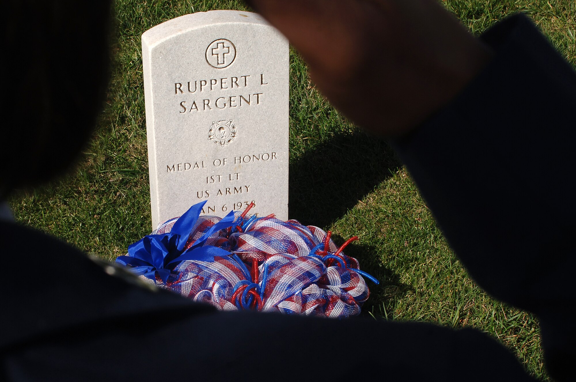 U.S. Air Force Staff Sgt. Tashara Webster, 633rd Medical Operations Squadron aerospace medical technician, salutes during a wreath-laying ceremony in honor of U.S. Army 1st Lt. Ruppert Sargent at the Hampton National Cemetery in Hampton,  Va., Nov. 11, 2013. The Langley African-American Heritage Council hosted the ceremony on Veterans Day to honor Sargent, who earned the Medal of Honor for his acts of valor during the Vietnam War. (U.S. Air Force photo by Senior Airman Teresa Aber/Released)