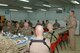 Gen. Mike Hostage, Air Combat Command commander, talks with 451st Air Expeditionary Wing Airmen at Kandahar Airfield, Afghanistan, Nov. 8, 2013. As a force provider for combat airpower in theater, He said meeting Airmen here allowed him a better understanding of expectations and requirements and gave him a chance to address concerns of deployed Airmen.  Hostage answered questions from Airmen about mission priorities, fiscal planning and future development plans. (U.S. Air Force photo by Senior Airman Jack Sanders)