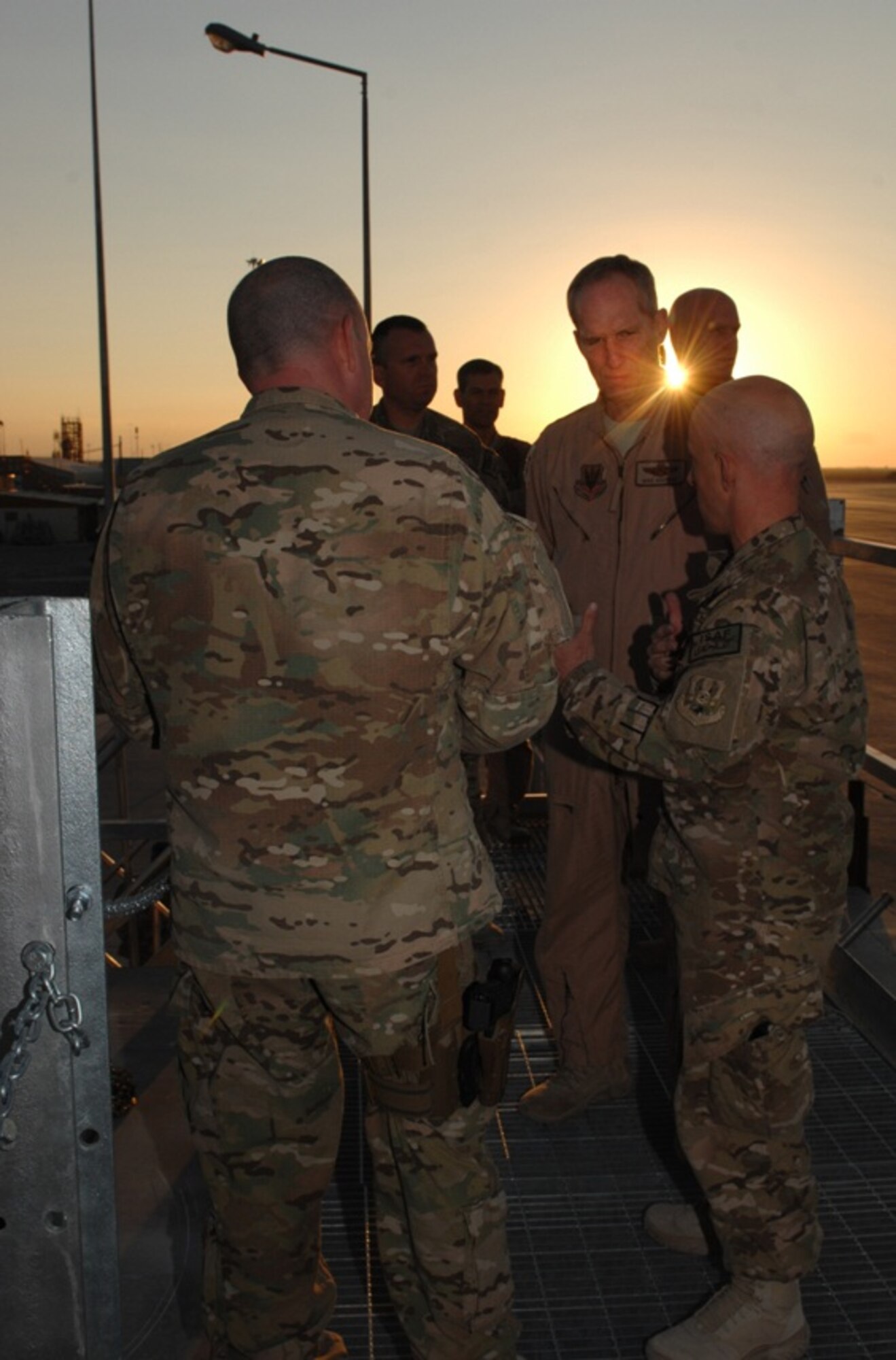 Airmen from the 451st Expeditionary Logistics Readiness Squadron brief Gen. Mike Hostage, Air Combat Command commander, on mission aspects at Kandahar Airfield, Afghanistan, Nov. 8, 2013. As a force provider for combat airpower in theater, Hostage talked to warfighting commanders, Airmen and members of the coalition team about their current operational issues and concerns. (U.S. Air Force photo by Senior Airman Jack Sanders)