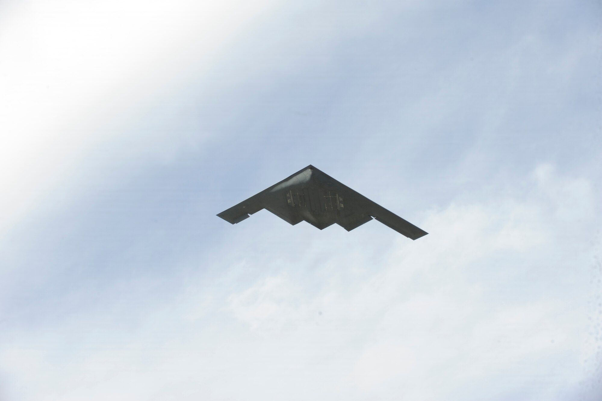 A B-2 Spirit stealth bomber flies over Whiteman Air Force Base, Mo., during training Nov. 3, 2013. The B-2 is manned by two pilots and can reach high subsonic speeds. (U.S. Air Force photo by Staff Sgt. Alexandra Boutte/Released)