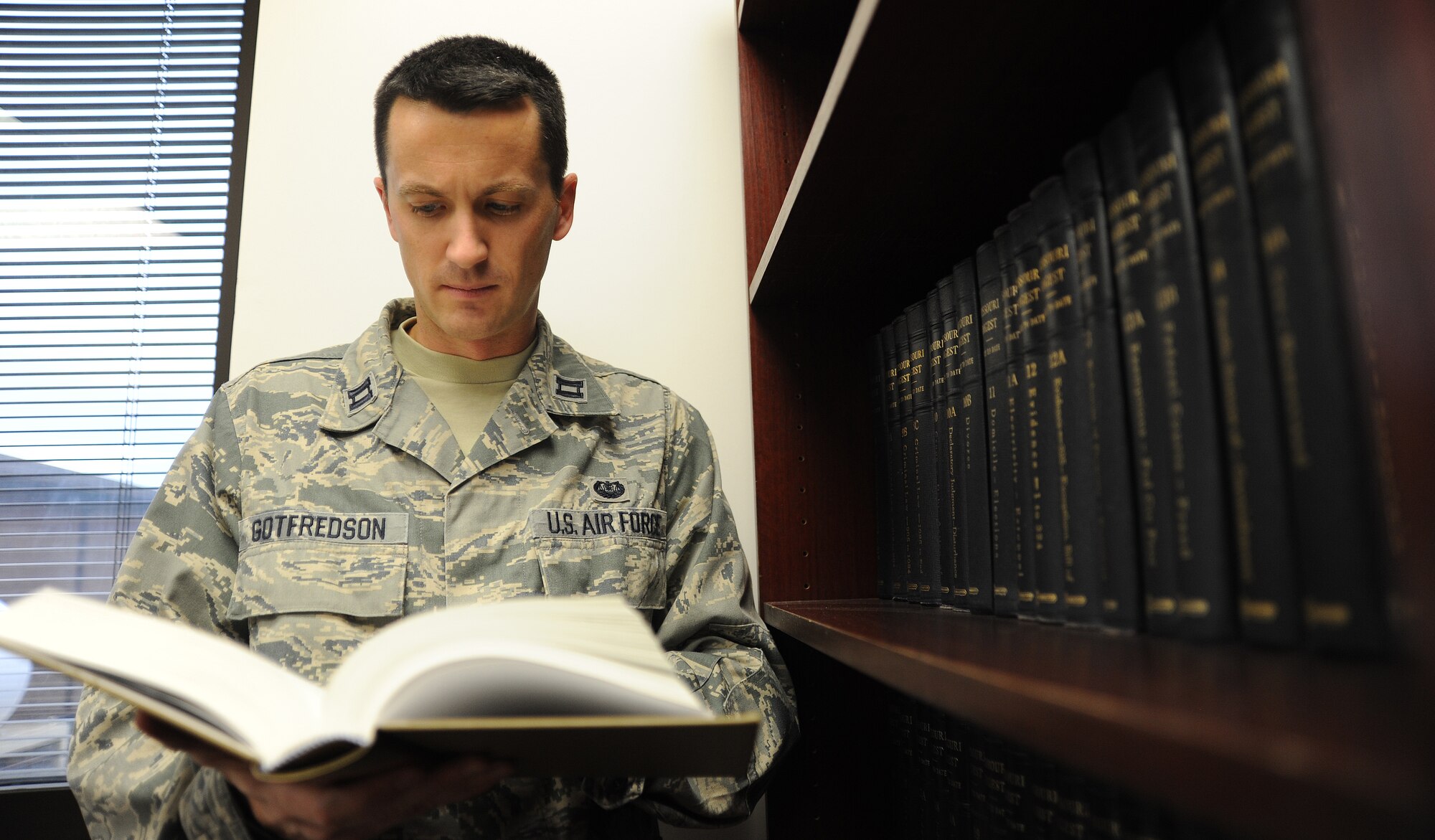 U.S. Air Force Capt. Kevin Gotfredson, 509th Bomb Wing Judge Advocate chief of military justice, researches case law in preparation for a court martial at Whiteman Air Force Base, Mo., Oct. 30, 2013. The 509th Bomb Wing staff judge advocate office performs four essential functions: military justice, operational law and legal assistance, protection of Air Force resources, and safeguarding freedom of action, morale and welfare. (U.S. Air Force photo by Staff Sgt. Nick Wilson/Released)