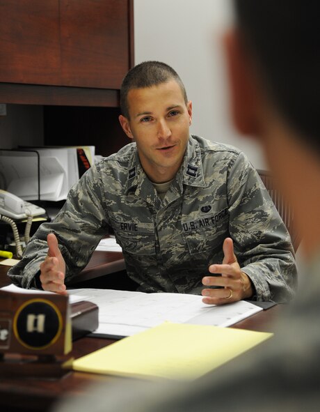 U.S. Air Force Capt. Phillip Ervie, 509th Bomb Wing Judge Advocate chief of adverse actions, provides legal assistance to an Airman at Whiteman Air Force Base, Mo., Oct. 30, 2013. The military justice system is designed to promote good order and discipline and to ensure mission accomplishment. (U.S. Air Force photo by Staff Sgt. Nick Wilson/Released)