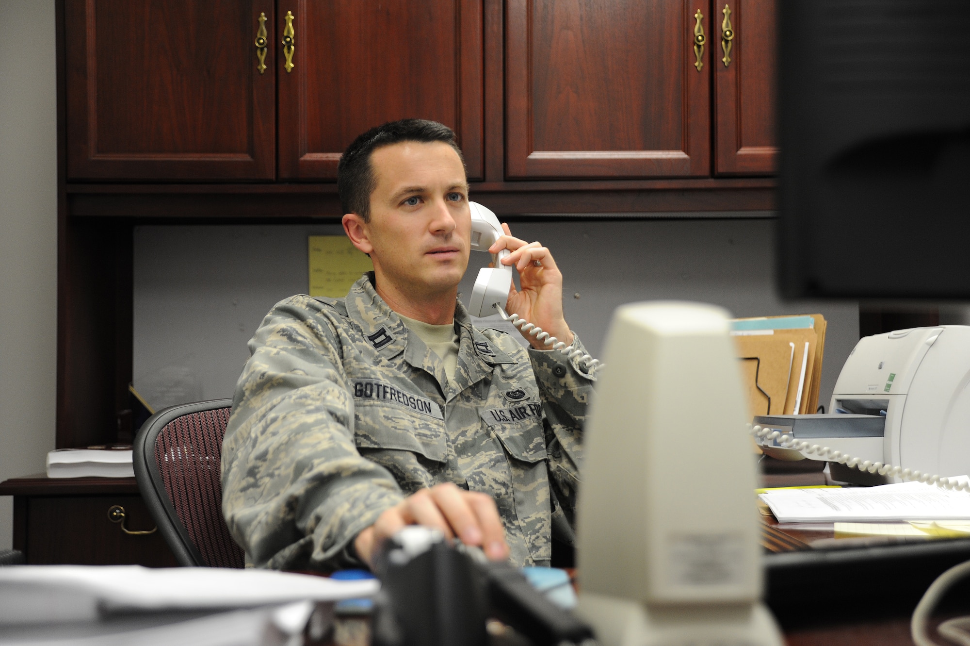 U.S. Air Force Capt. Kevin Gotfredson, 509th Bomb Wing Judge Advocate chief of military justice, advises a first sergeant on a disciplinary issue at Whiteman Air Force Base, Mo., Oct. 30, 2013. The legal office provides a variety of services in order to meet the legal needs of all active-duty, Guard and Reserve military members, civilians, dependents and retirees at Team Whiteman. (U.S. Air Force photo by Staff Sgt. Nick Wilson/Released)