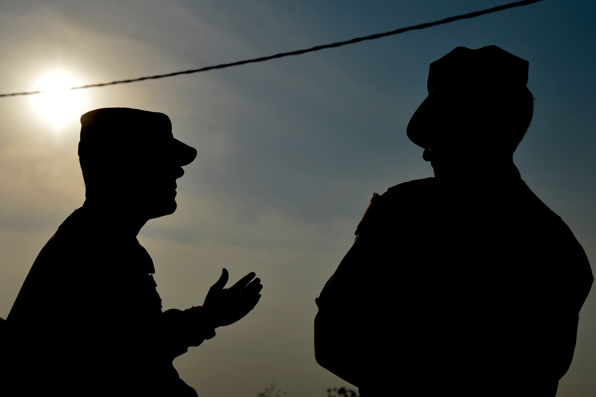 U.S. Air Force Gen. Mike Hostage, commander of Air Combat Command, speaks with Maj. Michael Speck, 455th Expeditionary Base Defense Squadron commander, during a base tour at Bagram Airfield, Afghanistan, Nov. 9, 2013. During the first of the two days he spent at BAF, Hostage toured six different areas and gained a better understanding of expectations and requirements and also addressed concerns of deployed Airmen. (U.S. Air Force photo by Senior Airman Kayla Newman/Released)
